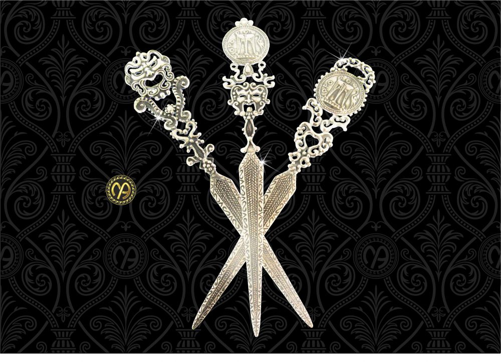 Tagliacarte in argento con maschere apotropaike e riproduzione dello Statere antica, moneta di Kroton.